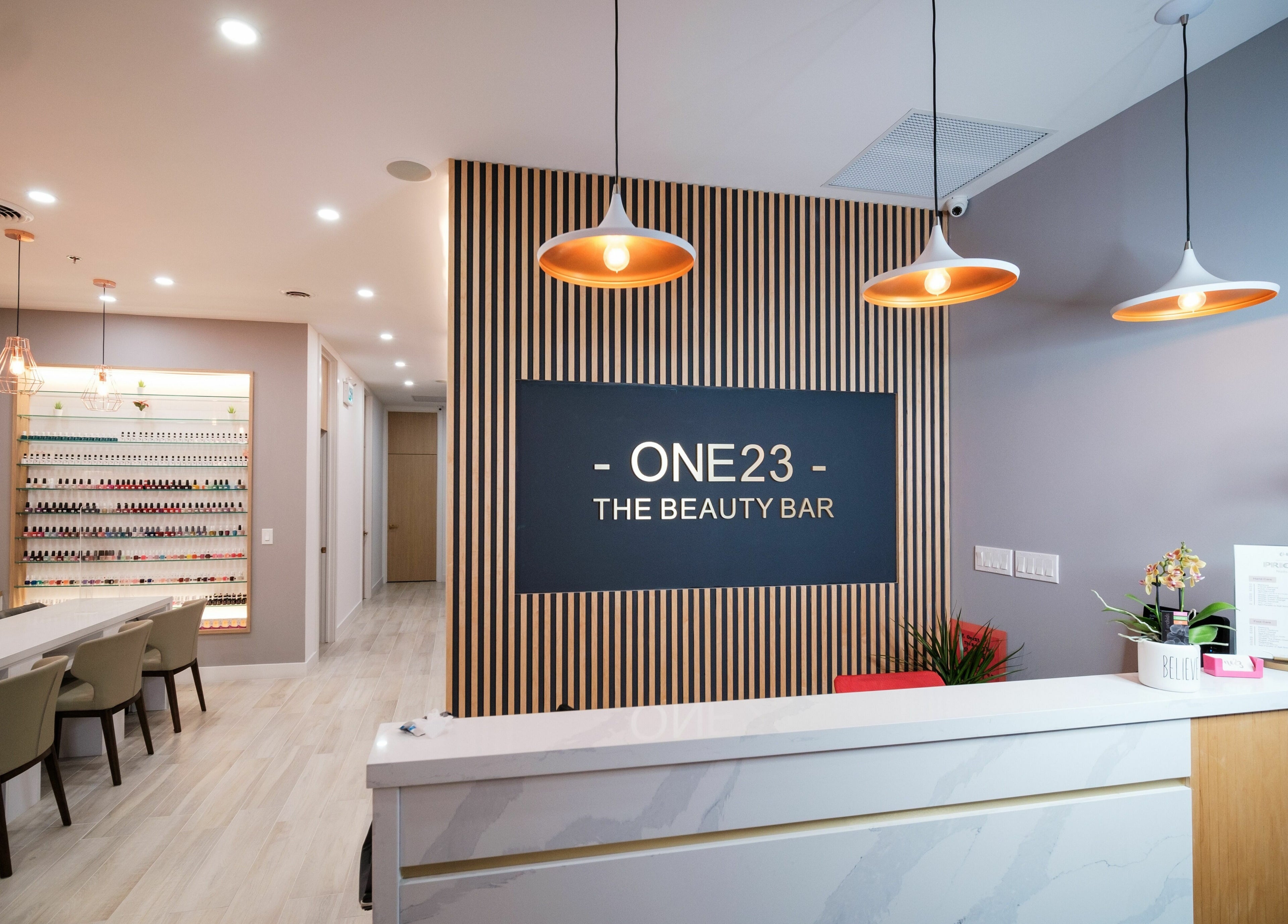 Modern reception at One23 Beauty Bar, Vaughan, Ontario, CA with elegant decor and inviting atmosphere.