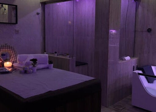 Relaxing massage room at Faisalia Center, الدمام, المنطقة الشرقية, SA with calming decor and bathtub.