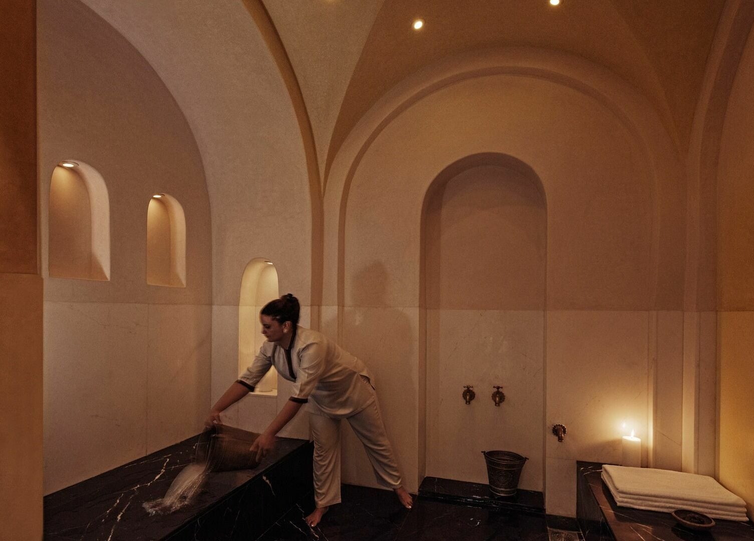 Hammam room at Farnatchi Spa, Marrakesh, Marrakesh-Safi, MA, highlighting elegant arches and serene atmosphere.