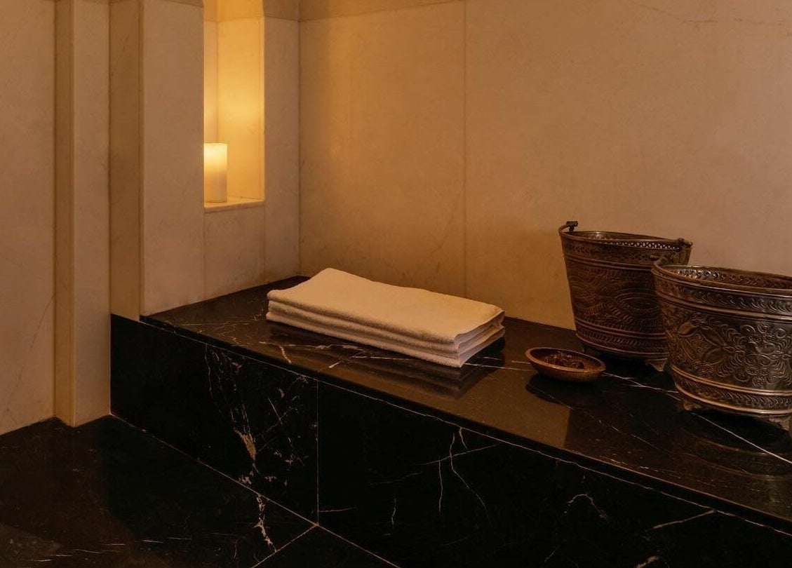 Elegant spa setting at Farnatchi Spa, Marrakesh, Marrakesh-Safi, MA with candles and ornate decor.