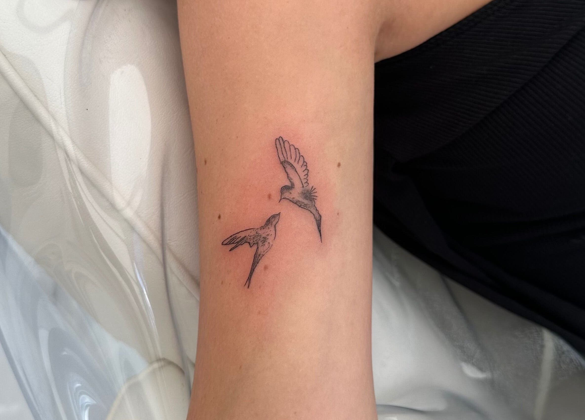 Detailed bird tattoo on arm from Indybeautyuk in Stilton, England, GB. Fine line body art in black ink.