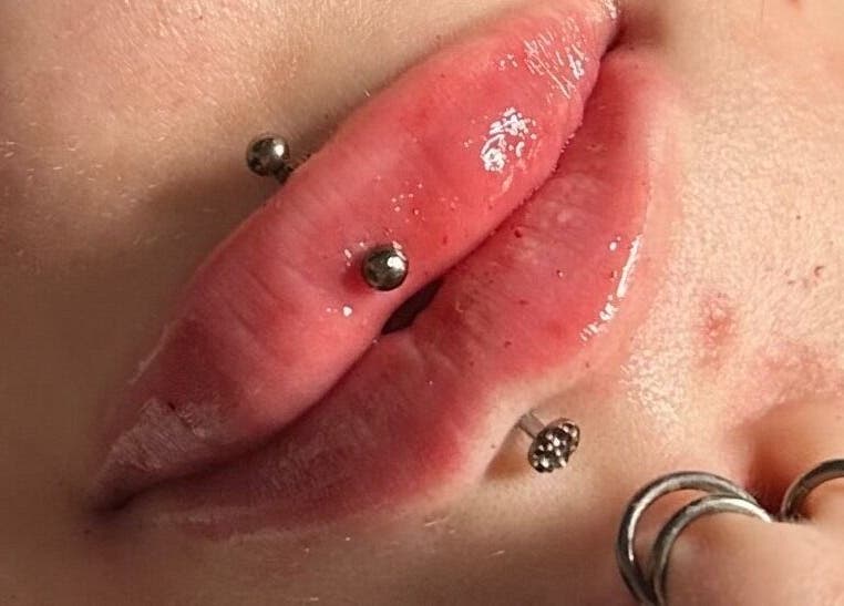 Close-up of modern lip piercings at Indybeautyuk, Stilton, England, GB.