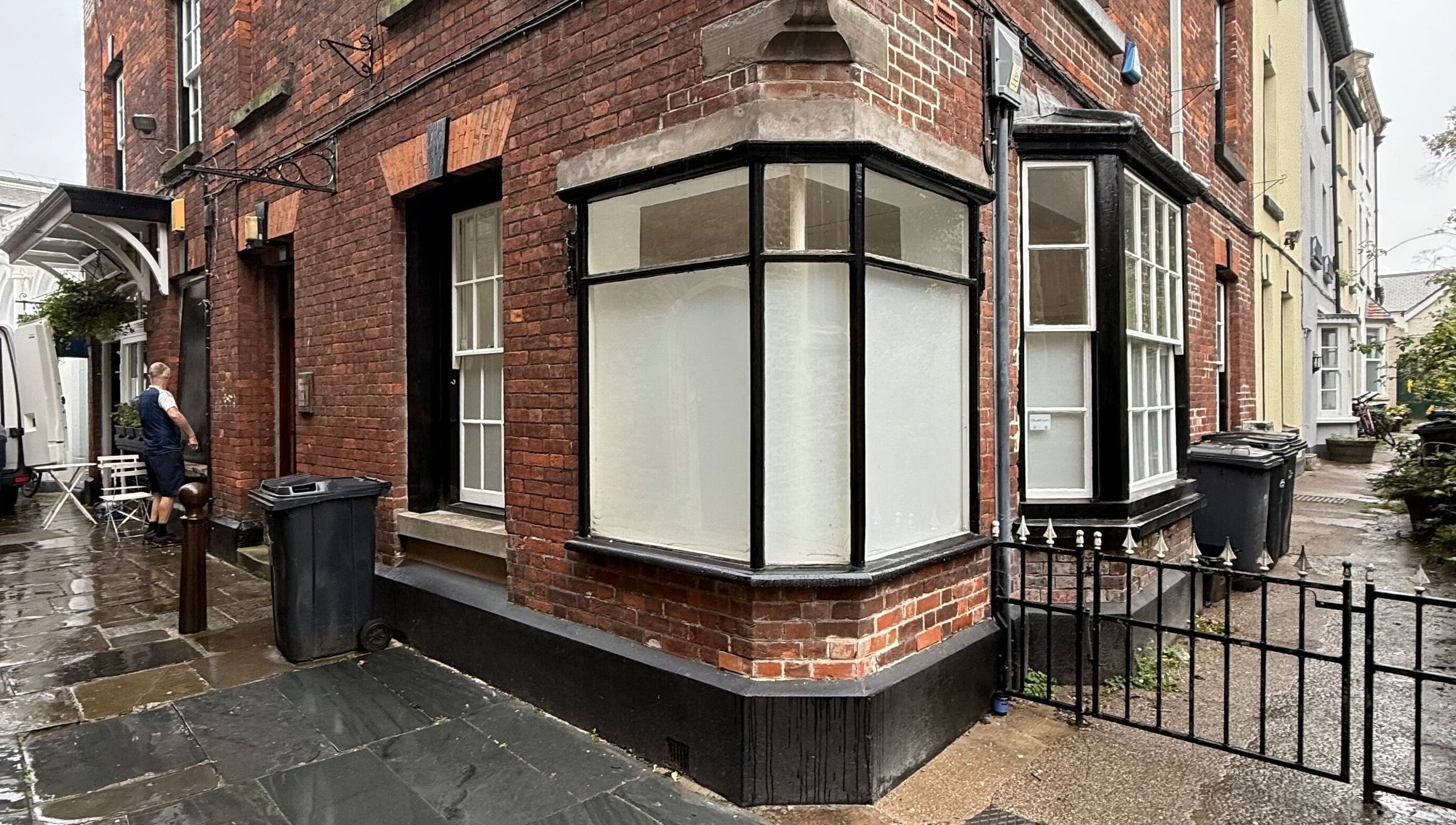 Charming brick exterior of Fleur Beauty | Skin and Wellbeing, Barnstaple, England, GB on a rainy day.