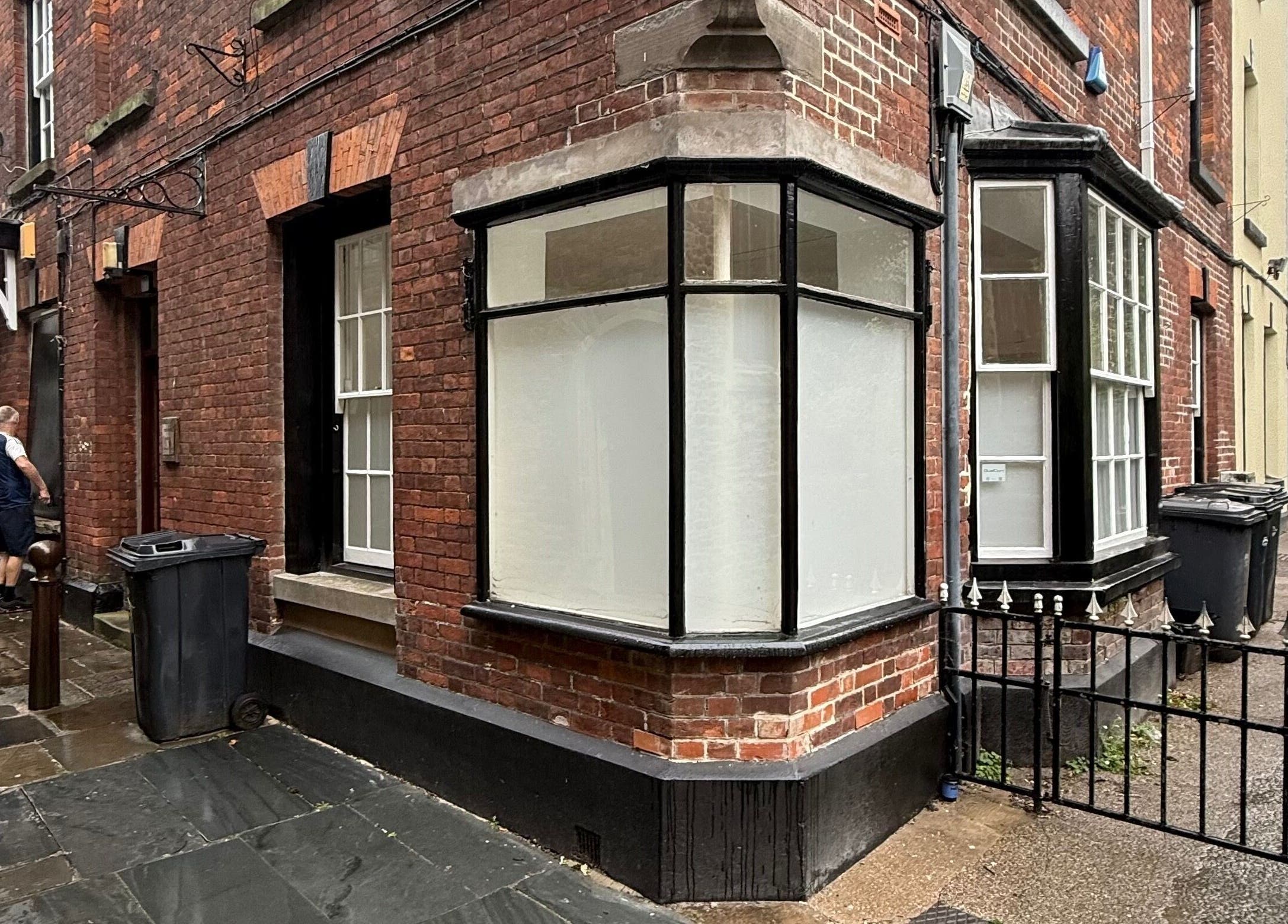 Charming brick exterior of Fleur Beauty | Skin and Wellbeing, Barnstaple, England, GB on a rainy day.