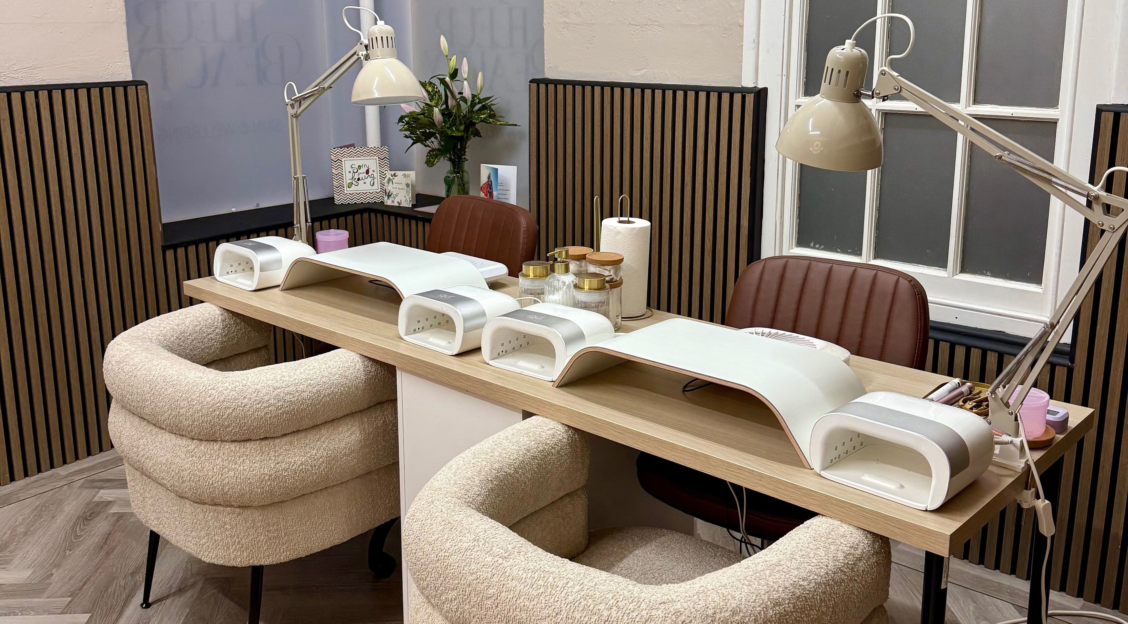 Modern nail station at Fleur Beauty | Skin and Wellbeing, Barnstaple, England, GB, with stylish decor.