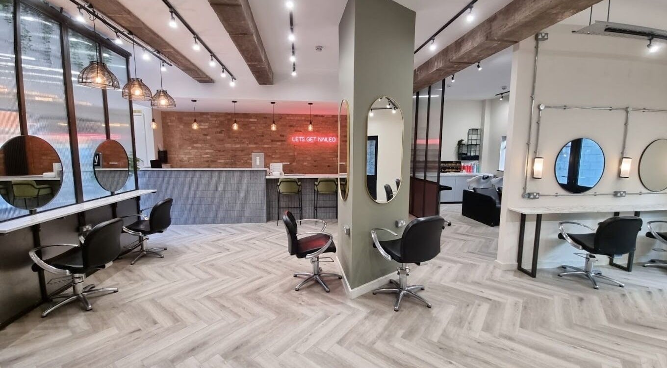 Stylish salon interior at W Creative in Kimberley, England, GB with modern decor and elegant styling stations.