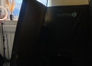 Tanning setup at Bronze Bar Tanning, Tranent, Scotland, GB featuring a cozy tanning tent and ring light.