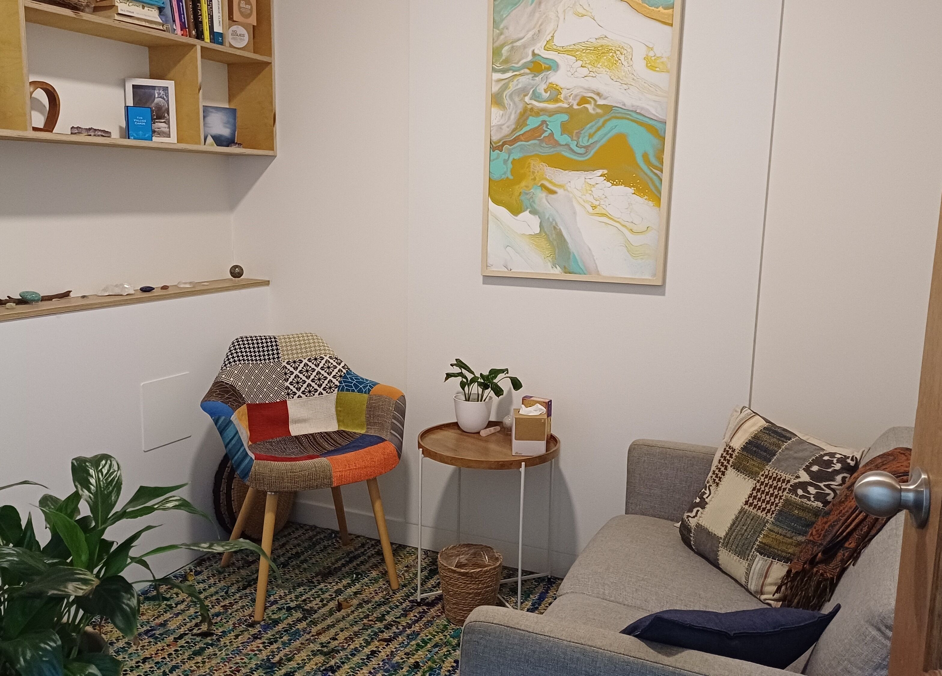 Charming room at Sacred Ground Australia, Palm Beach, Queensland, AU with colorful chair and art.