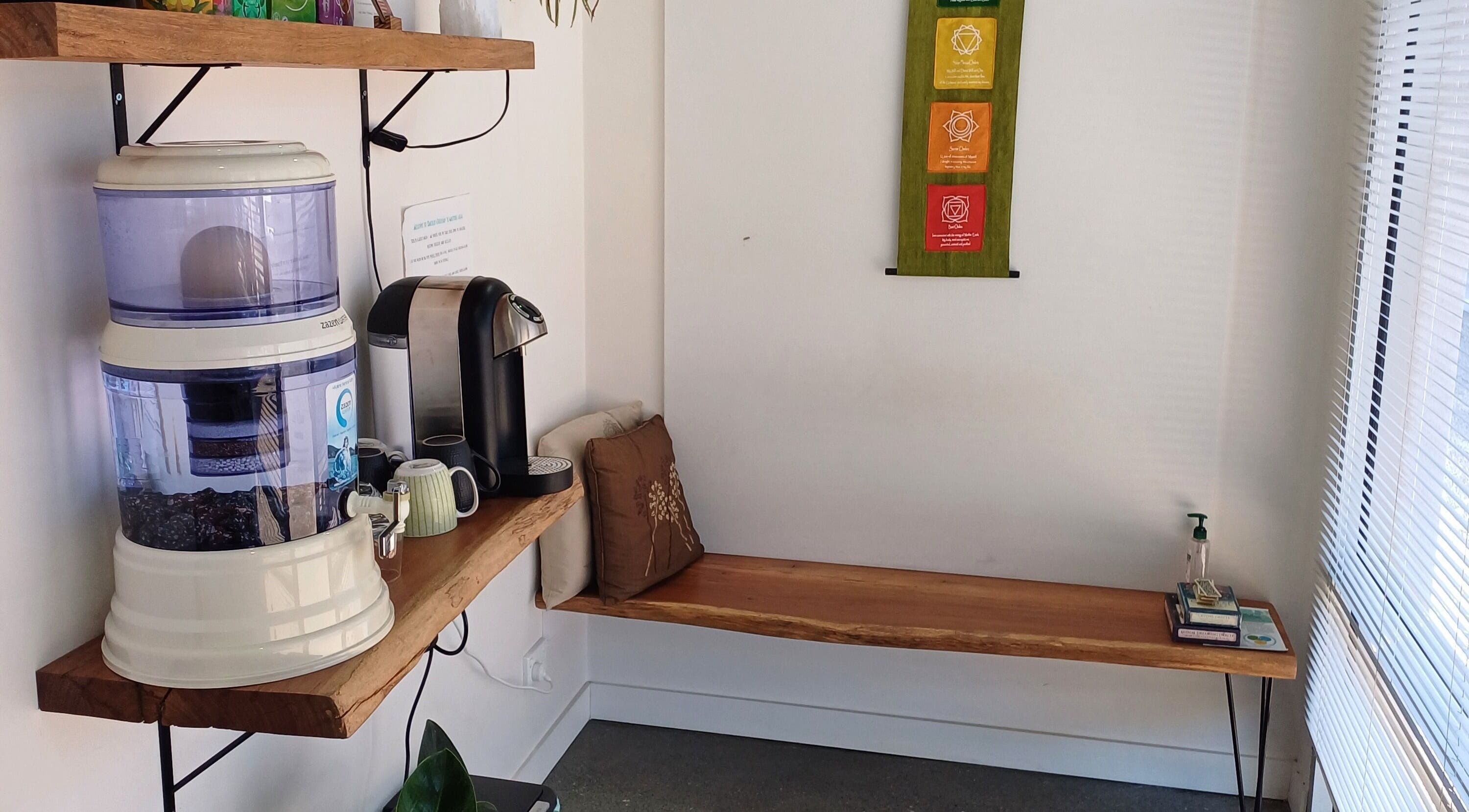 Cozy refreshment nook with water purifier at Sacred Ground Australia, Palm Beach, Queensland, AU.