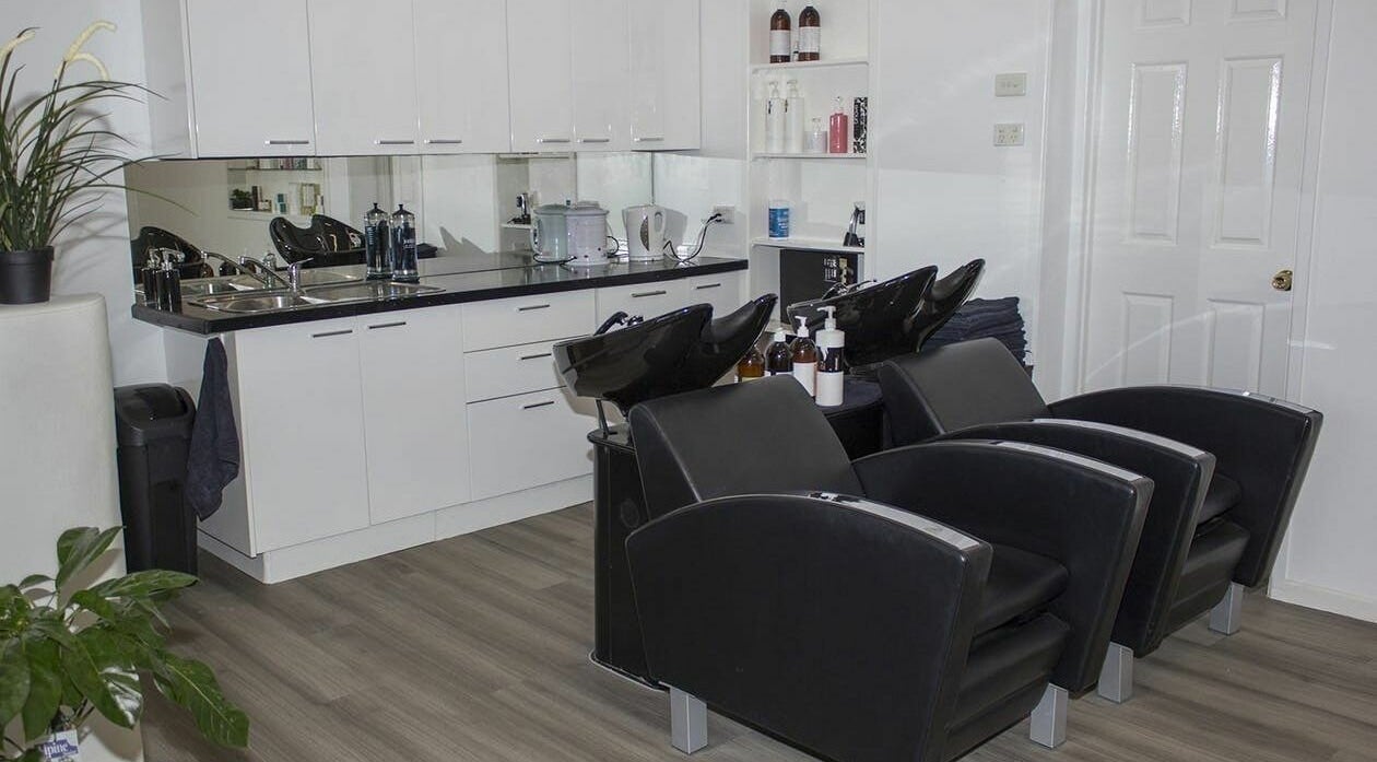 Sleek wash stations at Connie Janz Hair Studio, Newtown, Queensland, AU, offering premium hair care services.
