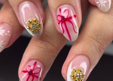 Festive nail art with snowflakes at Slayed Hair And Esthetics, Halifax, Nova Scotia, CA.