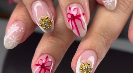 Festive nail art with snowflakes at Slayed Hair And Esthetics, Halifax, Nova Scotia, CA.
