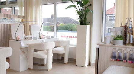 Elegant interior of GLOSS Nails, Dublin, County Dublin, IE, featuring plush chairs and serene decor.