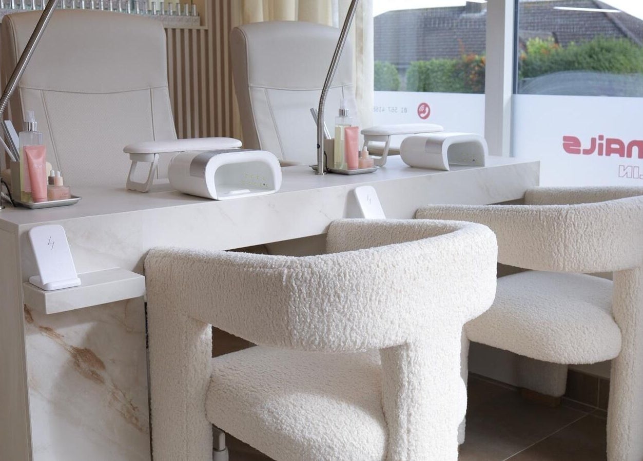 Elegant nail station at GLOSS Nails, Dublin, County Dublin, IE, featuring plush chairs and modern decor.