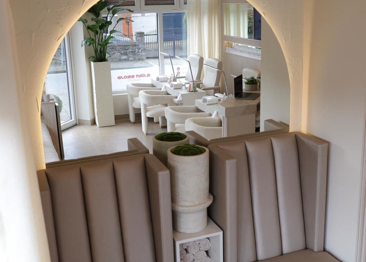 Interior of GLOSS Nails, Dublin, County Dublin, IE, featuring elegant seating and nail stations in a bright space.