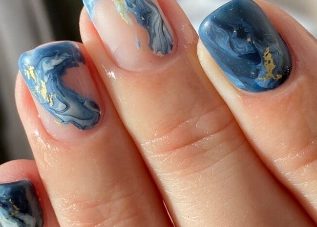 Blue marble nails with gold accents at Let's Relax, Park Gate, England, GB.