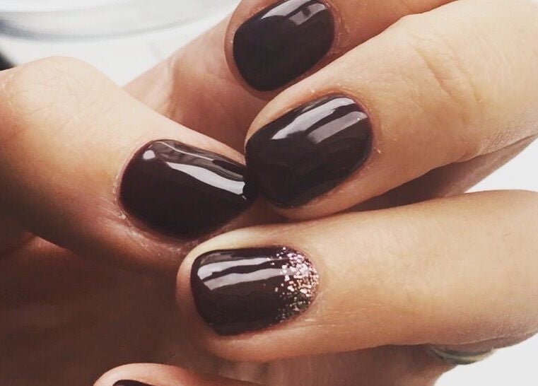 Elegant dark nails with glitter accent at Let's Relax, Park Gate, England, GB.