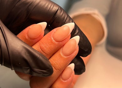 French manicure detail at The Beaut-E Club, Glasgow, Scotland, GB, showcasing nude and white nail art.