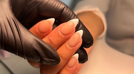 French manicure detail at The Beaut-E Club, Glasgow, Scotland, GB, showcasing nude and white nail art.