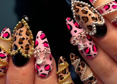 Leopard print nail art with vibrant designs at The Beaut-E Club, Glasgow, Scotland, GB.