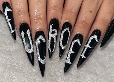 Elegant black nails with silver glitter details at The Beaut-E Club, Glasgow, Scotland, GB.