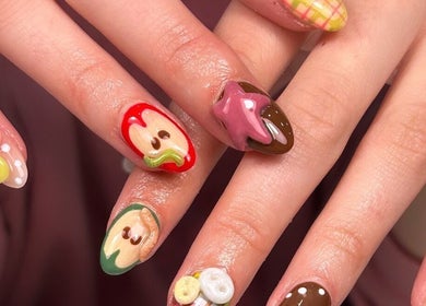 Creative nail art at The Beaut-E Club, Glasgow, Scotland, GB, featuring playful designs and vibrant colors.