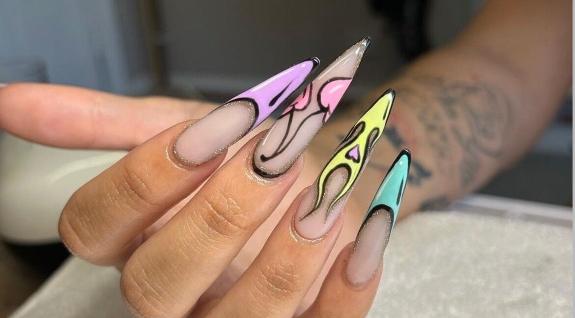 Vibrant flame nail art at The Beaut-E Club, Glasgow, Scotland, GB. Colorful and creative nail design.