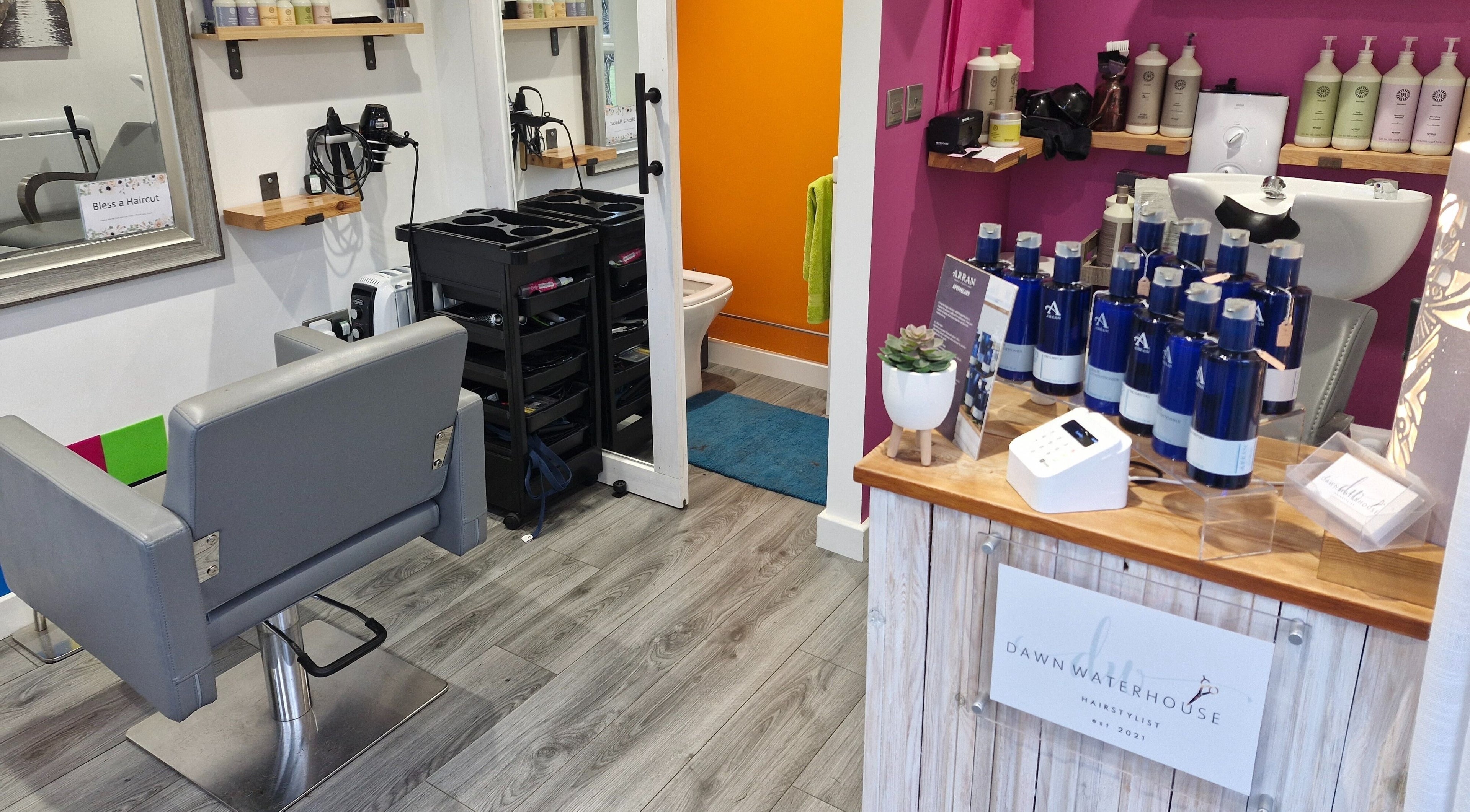 Stylish interior of Dawn Waterhouse Salon in Skipton, England, GB featuring modern hairdressing station.