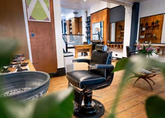 Elegant barber chair and decor at TAW, Tunbridge Wells, England, GB, offering a stylish grooming experience.
