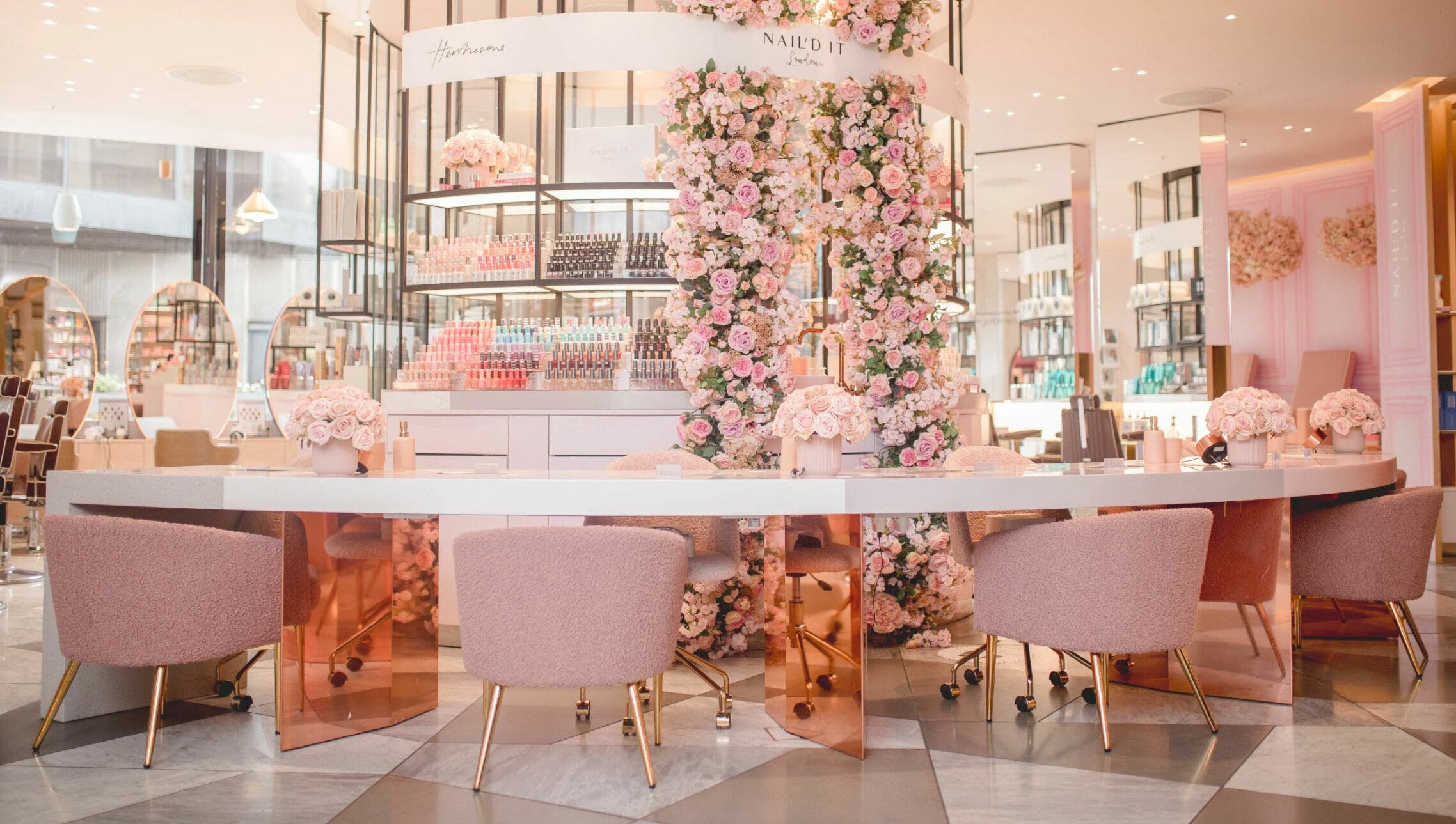 Elegant floral interior of Nail'd It Knightsbridge salon, London, England, GB with pink decor.
