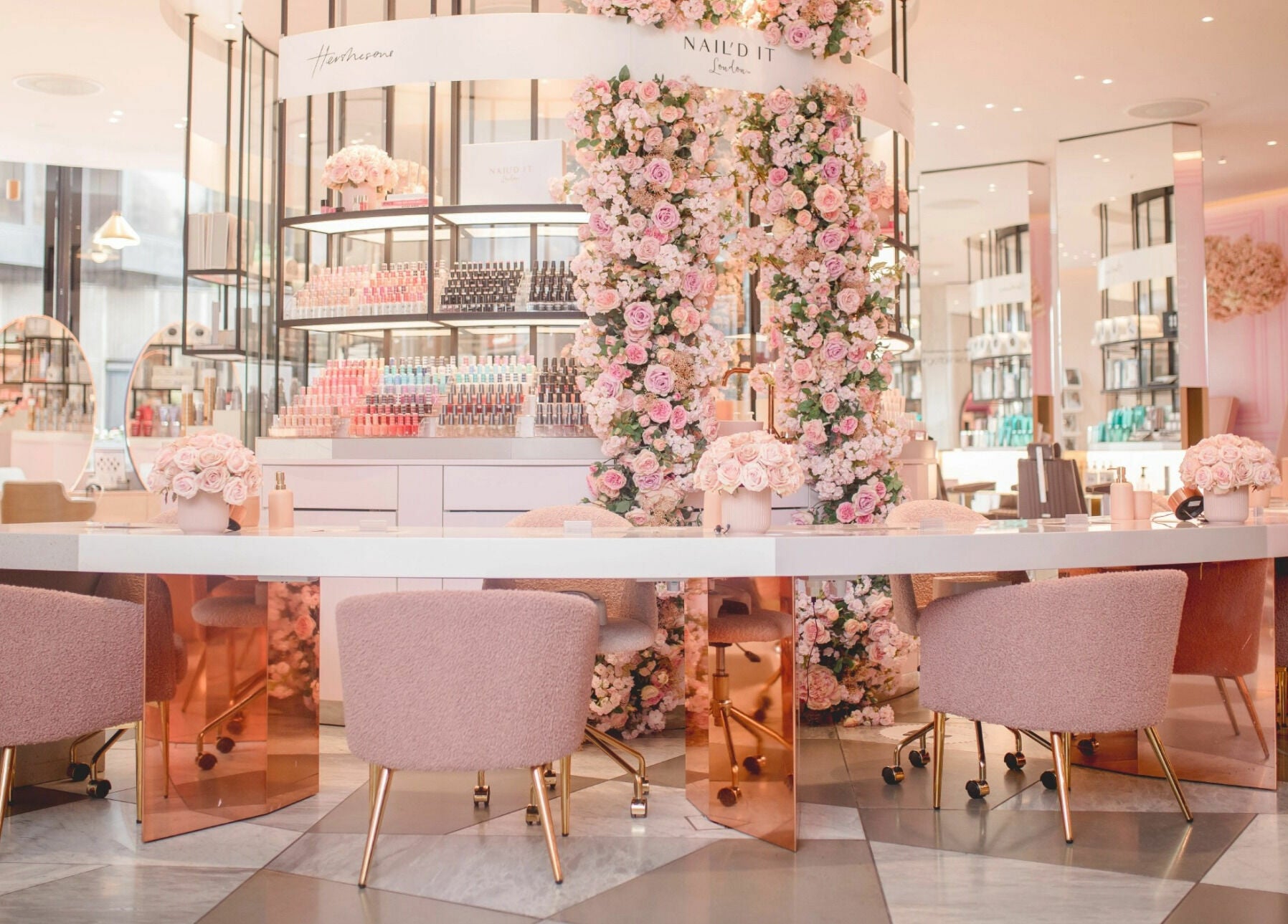 Elegant floral interior of Nail'd It Knightsbridge salon, London, England, GB with pink decor.