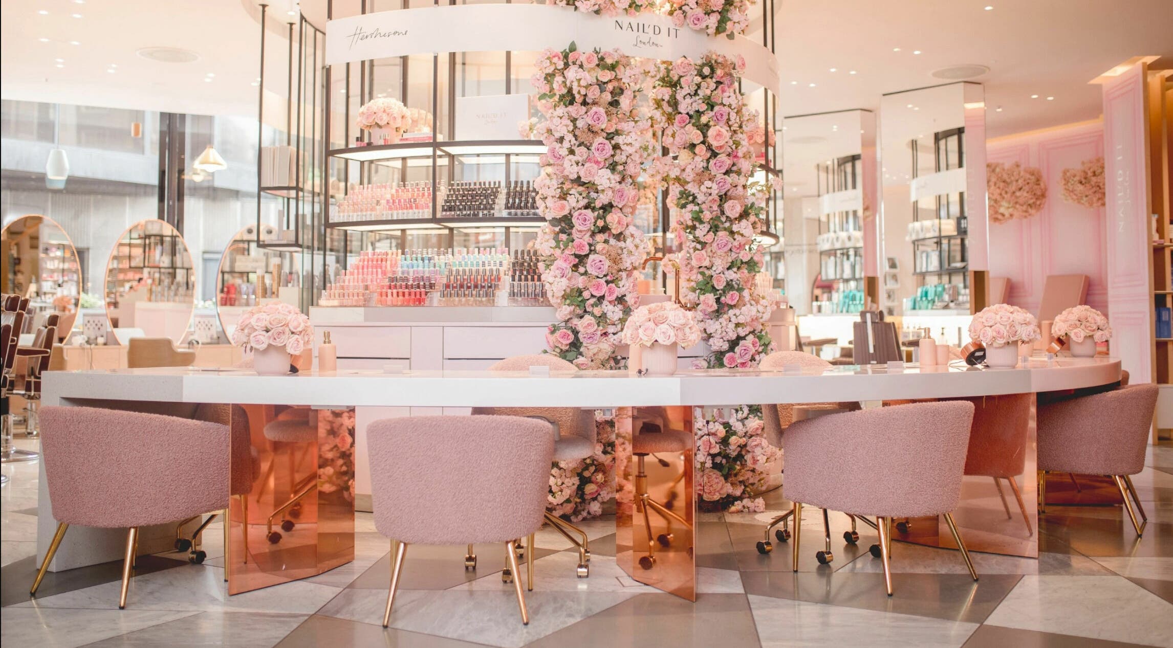 Elegant floral interior of Nail'd It Knightsbridge salon, London, England, GB with pink decor.