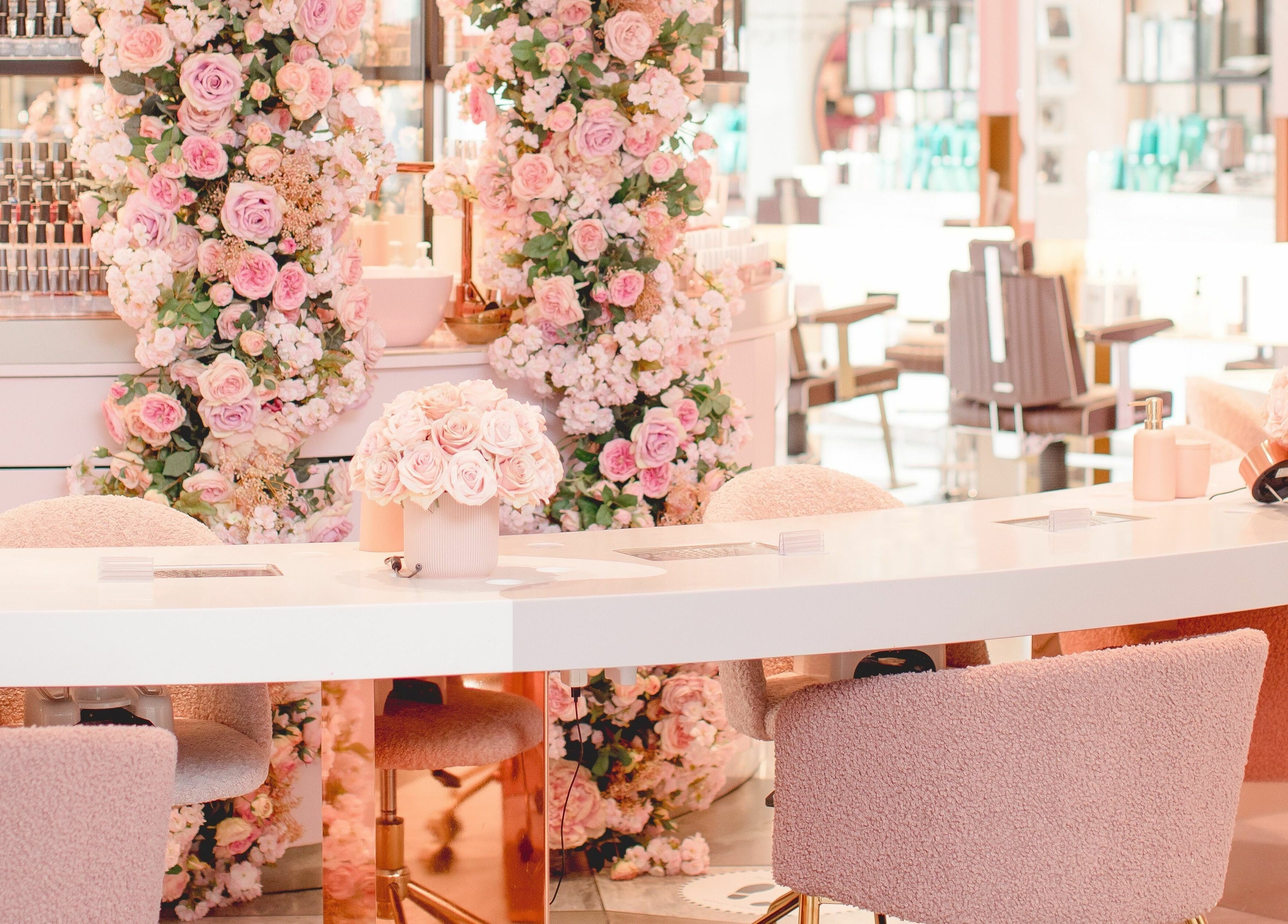 Luxurious nail salon at Nail'd It Knightsbridge, adorned with pink roses, located in London, England, GB.