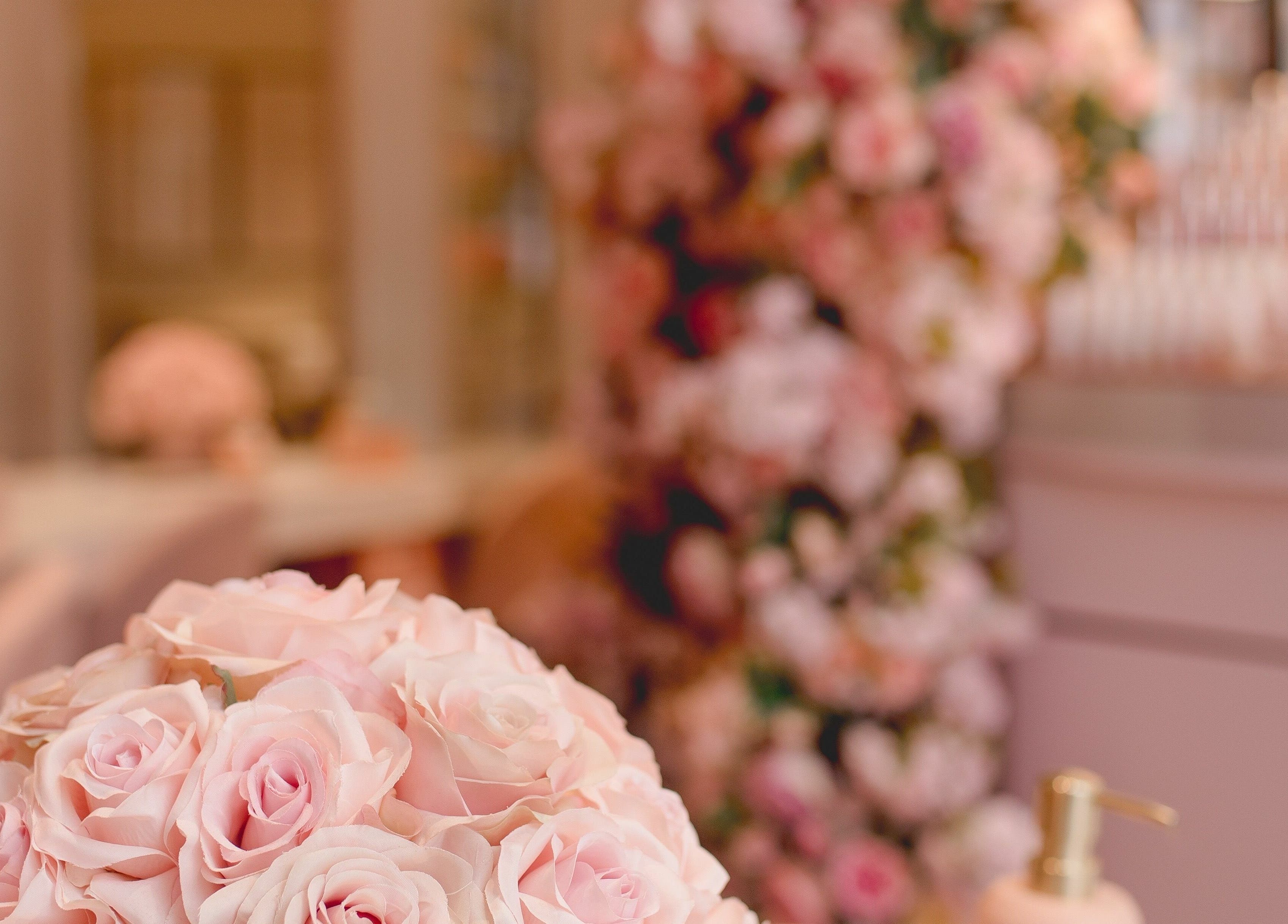 Beautiful floral decor at Nail'd It Knightsbridge, London, England. Luxurious ambiance with pink roses.