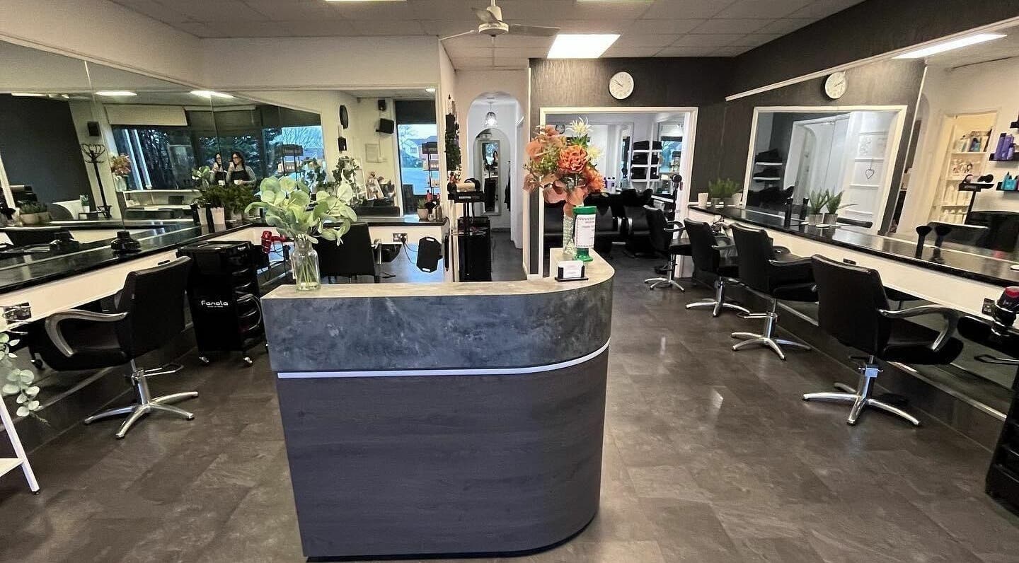 The Hair Company in Woolwell, England, GB offers a modern salon with sleek styling stations and welcoming decor.