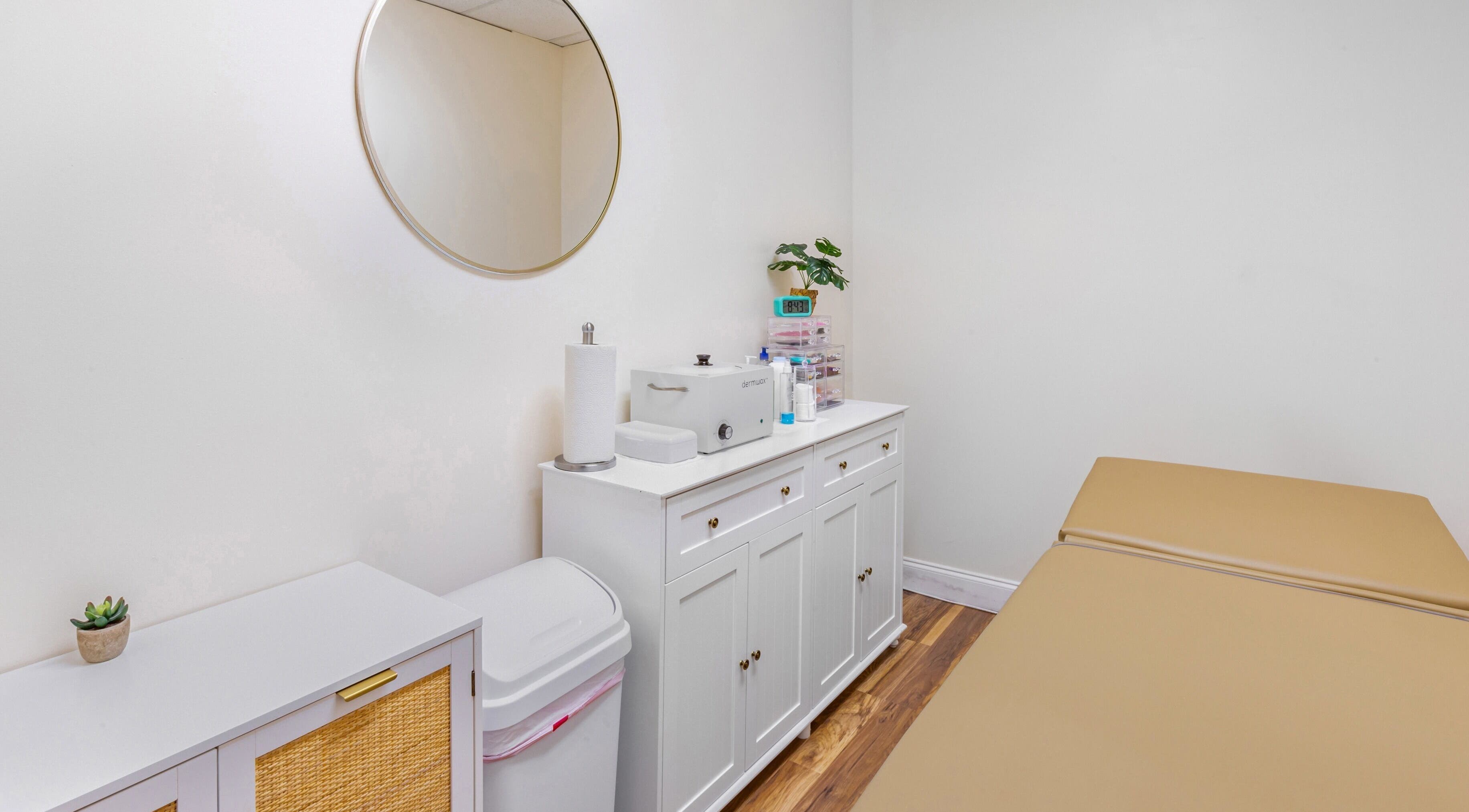 Serene treatment room at Mad Wax in Largo, Florida, US with a massage table and stylish decor.