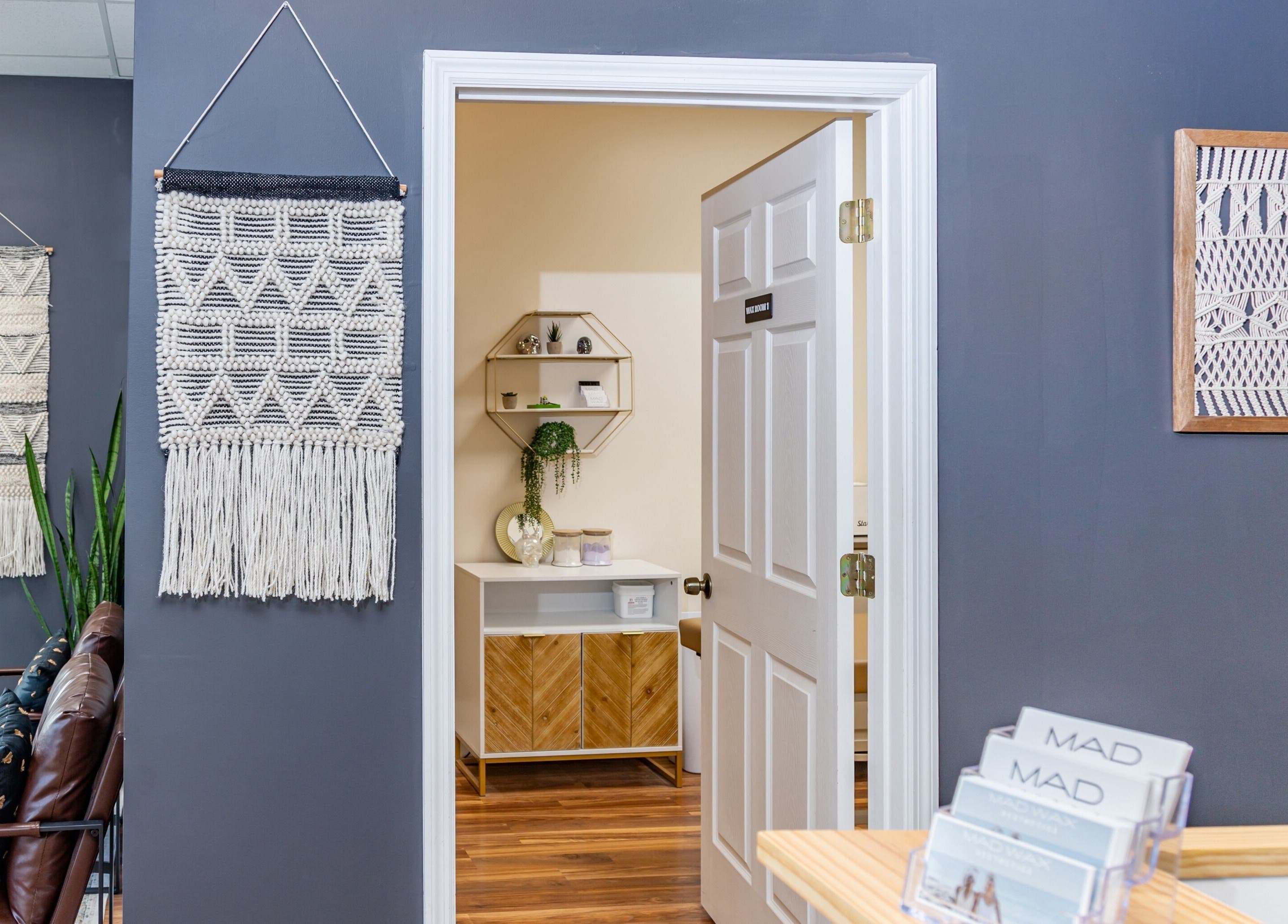 Inviting entrance with stylish decor at Mad Wax in Largo, Florida, US, showcasing modern aesthetics.