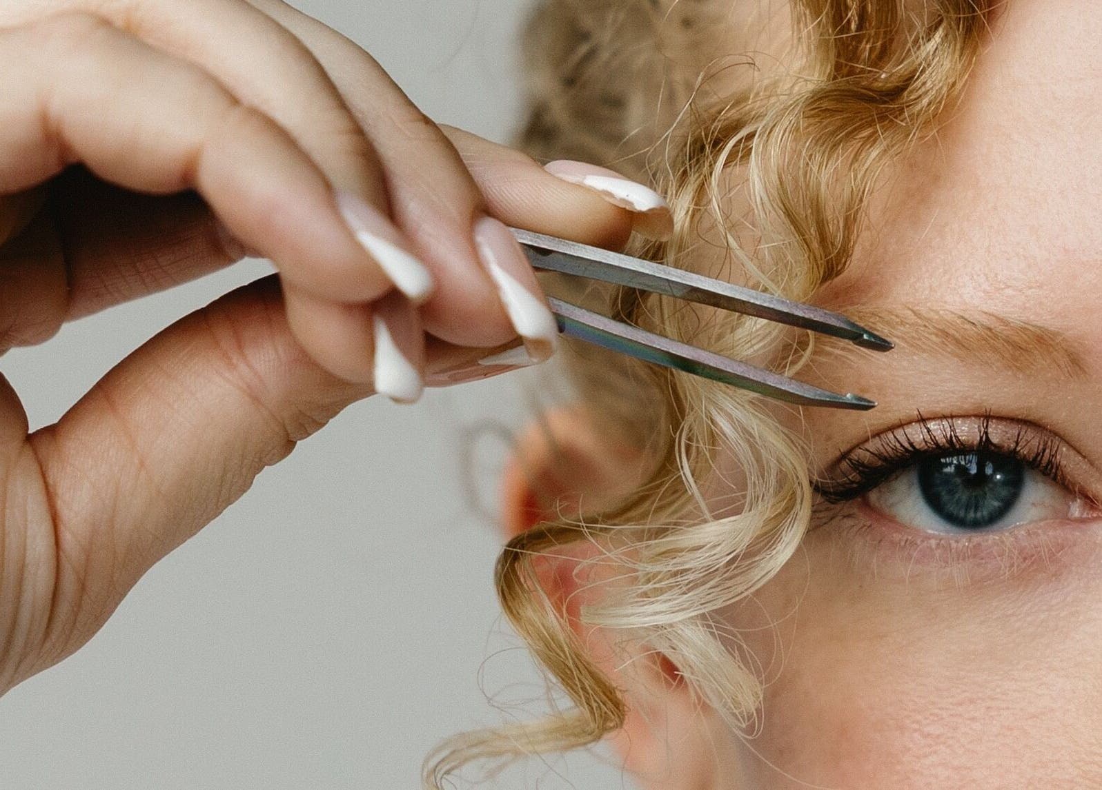 Precision eyebrow grooming at Mad Wax in Largo, Florida, US. Enhance your look with expert tweezing services.