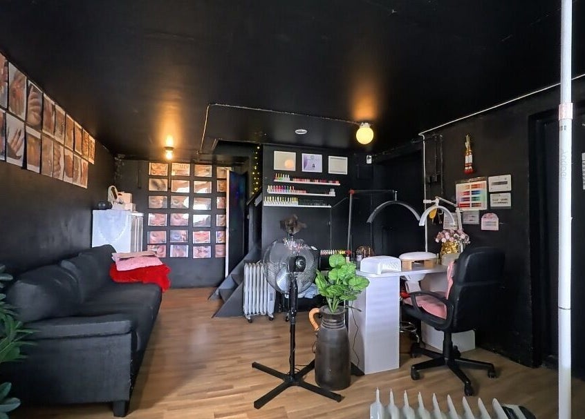 Chic interior of Thitty Lashes in Moi, Rogaland, NO with cozy seating and nail art displays.