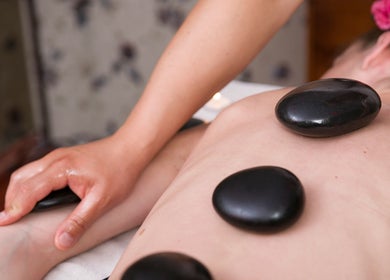 Hot stone massage at Li's Spa in Redmond, Washington, US, promoting relaxation and wellness.