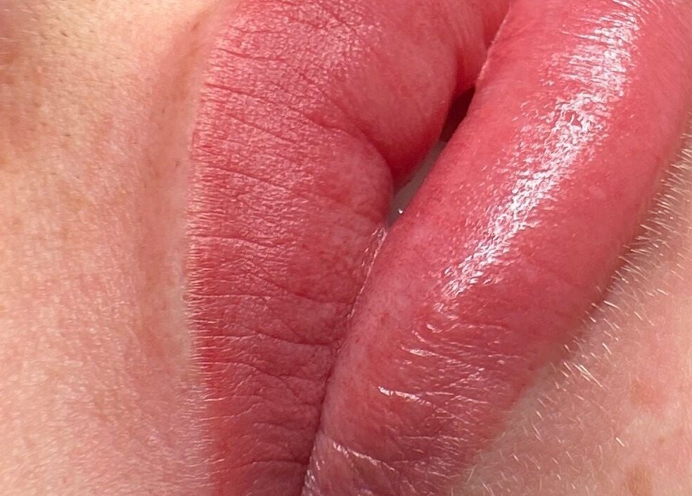 Close-up of glossy lips enhancing the beauty at Lashes by Sann in Leighton Buzzard, England, GB.