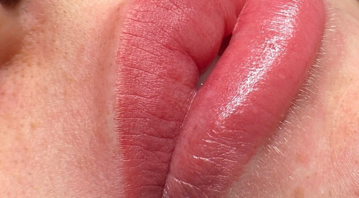 Close-up of glossy lips enhancing the beauty at Lashes by Sann in Leighton Buzzard, England, GB.
