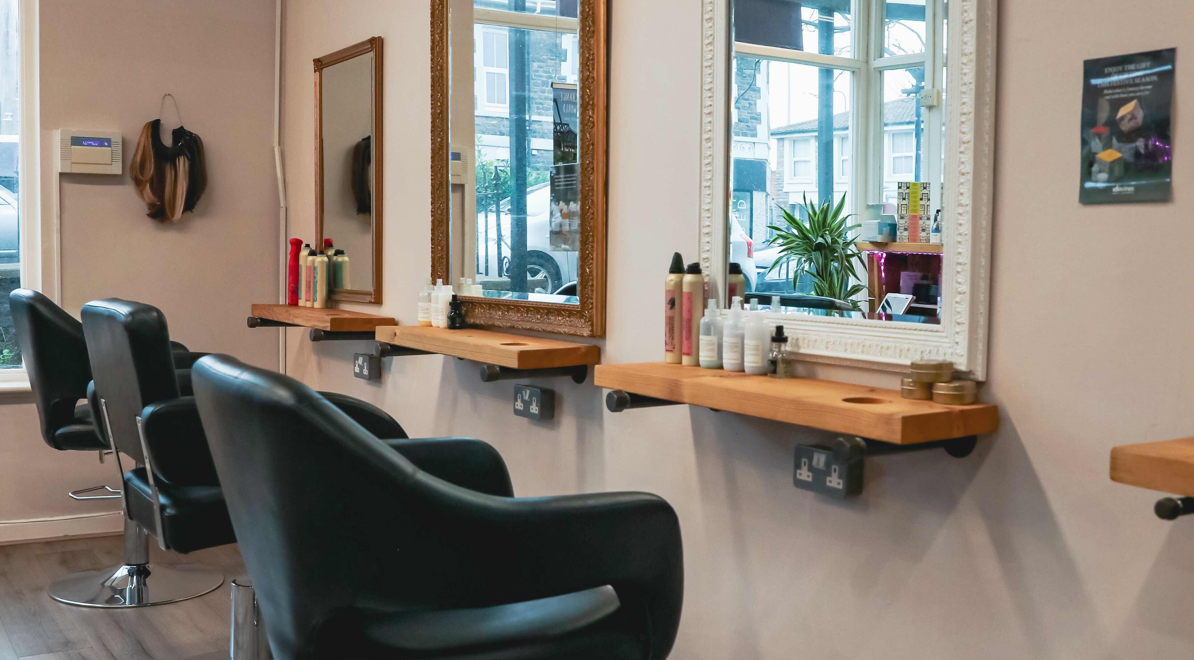 Escape Hair salon interior with styling chairs and mirrors in Clevedon, England, GB.