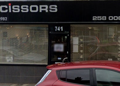 Street view of Pampered Beauties entrance in Sheffield, England, GB showcasing modern design.