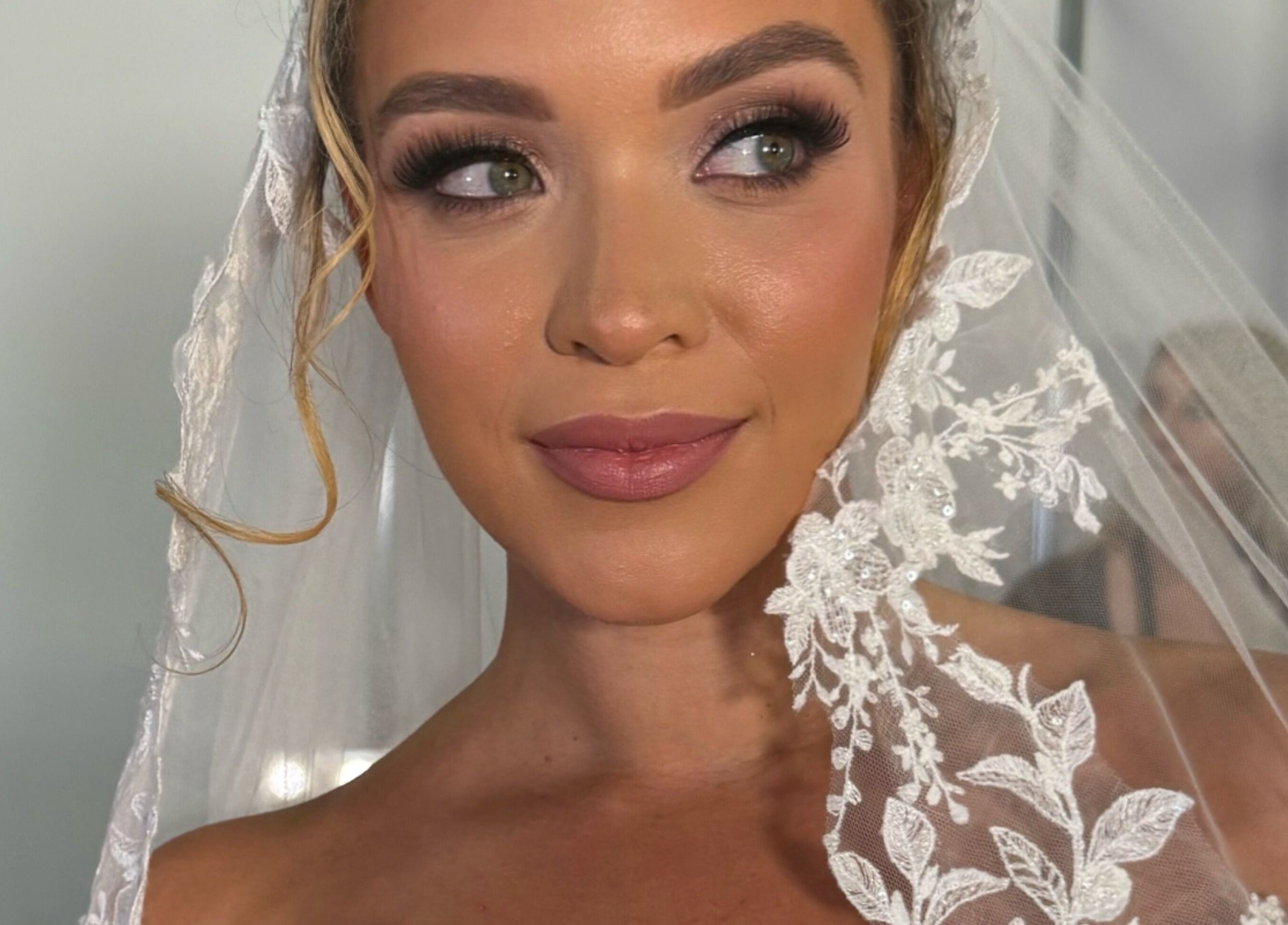 Elegant bridal makeup at Professional Beauty, Dungarvan, County Waterford, IE featuring intricate lace veil.