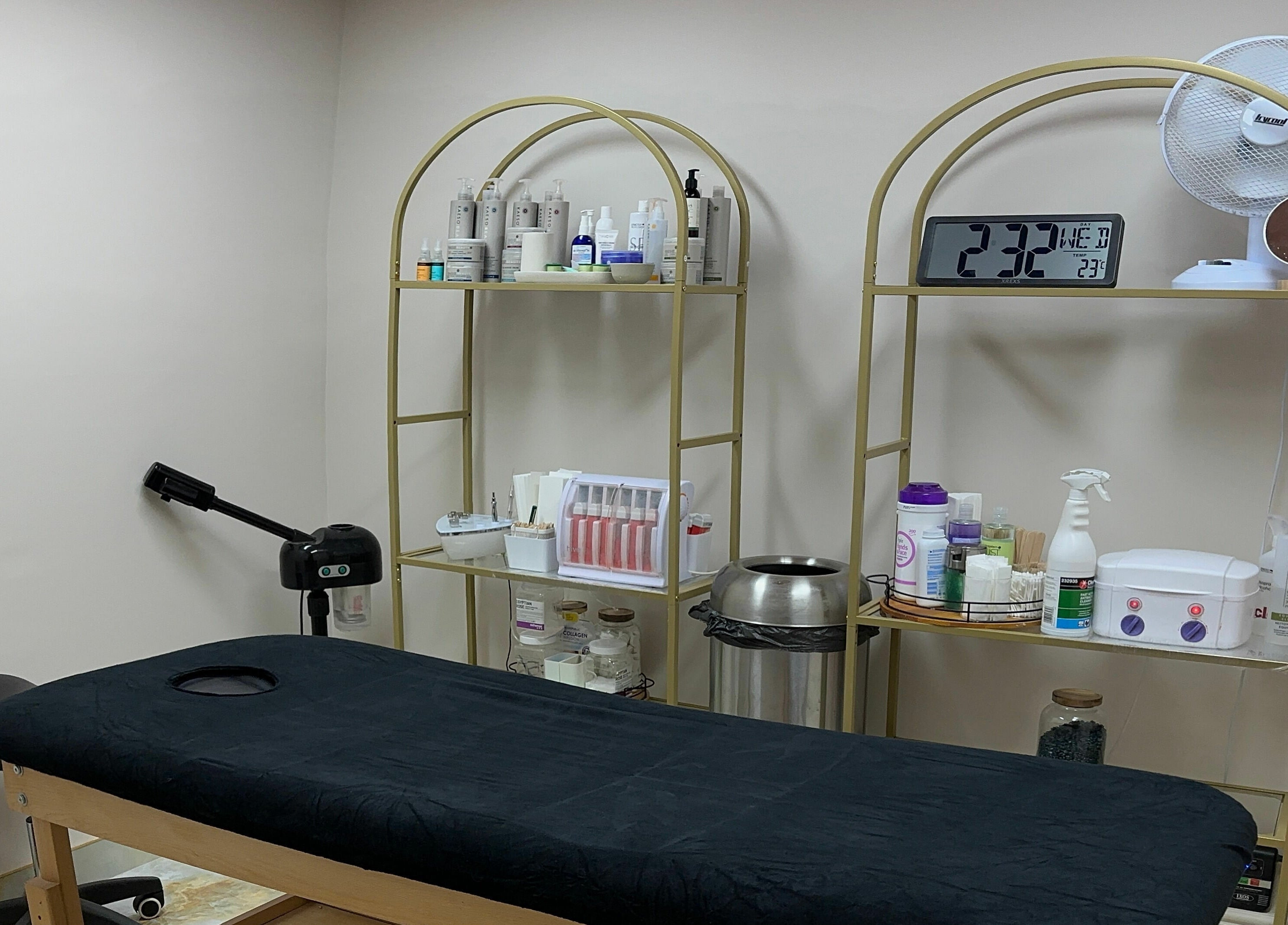Treatment room at Gorj Brows Beauty - Strood, Rochester, England, GB, featuring a massage table and beauty products.