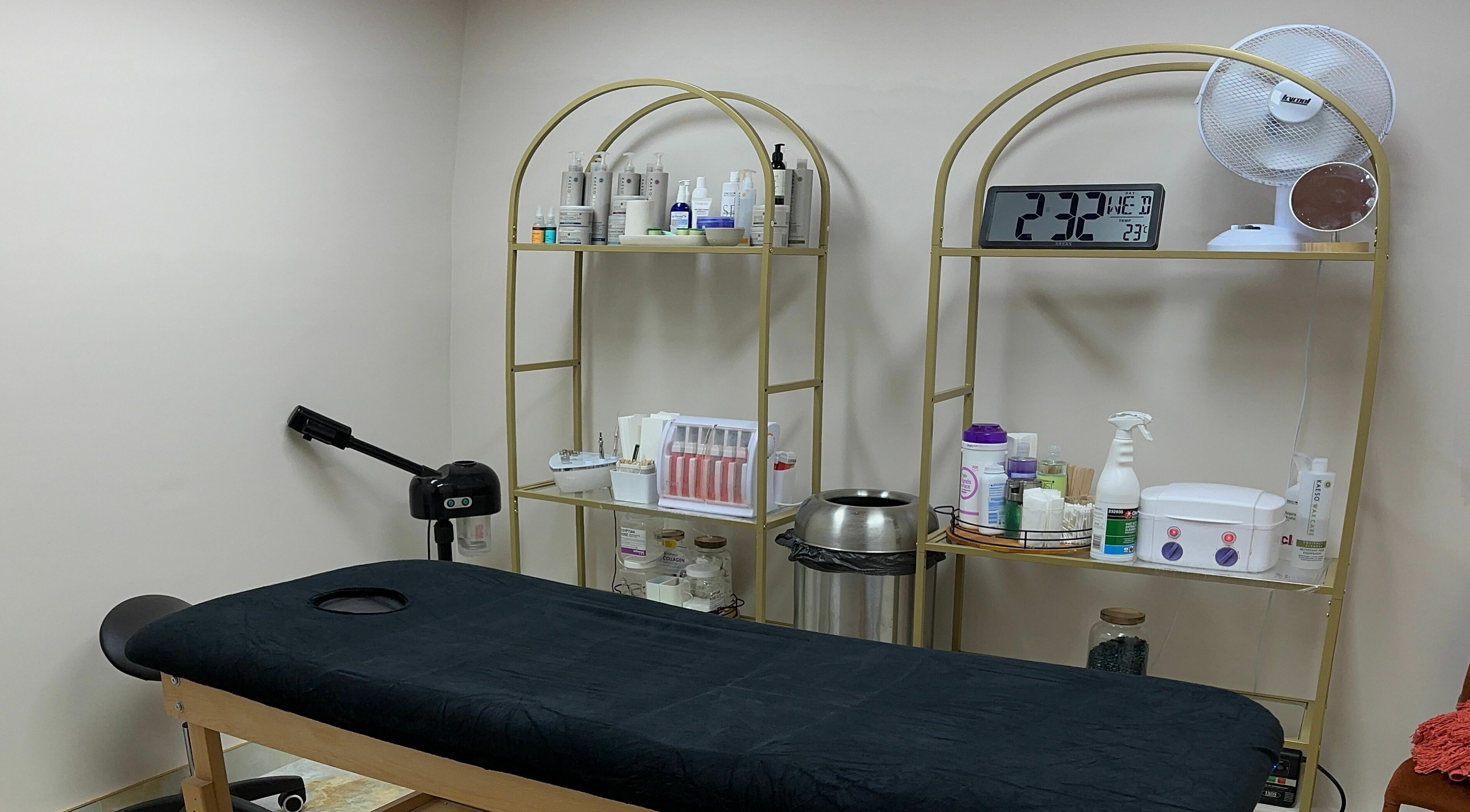Treatment room at Gorj Brows Beauty - Strood, Rochester, England, GB, featuring a massage table and beauty products.