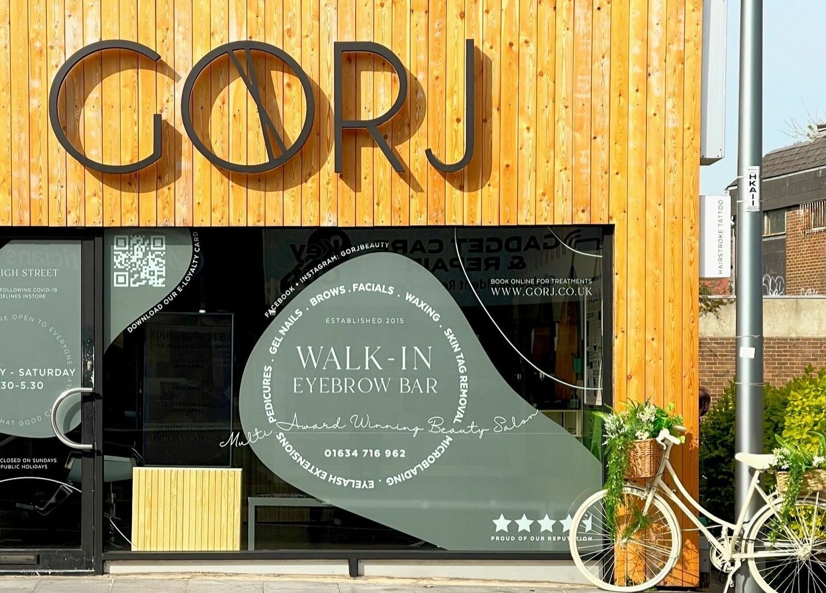 Front view of Gorj Brows Beauty - Strood, Rochester, England, GB showcasing elegant wooden exterior and signage.