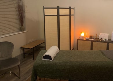 Calming massage room setup at Albion Massage Therapy, Cambridge, England, GB with dim lighting and tranquil decor.