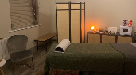 Cozy massage room at Albion Massage Therapy, Cambridge, England, GB with a serene setup and warm lighting.